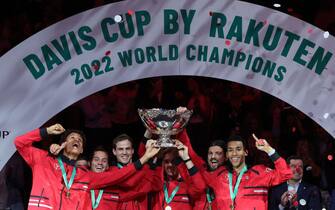 Canada's team holds the trophy after winning the Davis Cup tennis tournament at the Martin Carpena sportshall, in Malaga on November 27, 2022. - Felix Auger-Aliassime sealed tennis history for Canada as they won their first Davis Cup title by beating Australia 2-0 in November 27, 2022's finals in Malaga. (Photo by Thomas COEX / AFP) (Photo by THOMAS COEX/AFP via Getty Images)