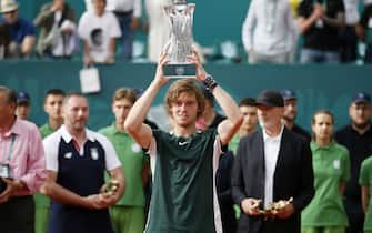 Russia's Andrey Rublev who defeated Serbia's Novak Djokovic in final match of the Serbia Open tennis tournament, holds the trophy during the award ceremony, in Belgrade, Serbia.