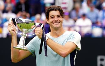 USA's Taylor Fritz celebrates with the trophy after winning the men's singles final match against USA's Maxime Cressy on centre court on day eight of the Rothesay International Eastbourne at Devonshire Park, Eastbourne. Picture date: Saturday June 25, 2022.