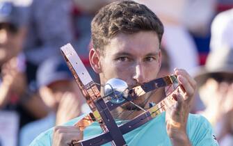 Pablo Carreno Busta, of Spain, kisses the trophy as he celebrates after defeating Hubert Hurkacz, of Poland, in the final of the National Bank Open tennis tournament in Montreal, PQ, Canada on Sunday, August 14, 2022. Photo by Paul Chiasson/CP/ABACAPRESSS.COM