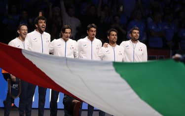 epa10329903 Team Italy listen to the anthem before their match in the Davis Cup semi final between Italy and Canada held in Malaga, Andalusia, southern Spain, 26 November 2022.  EPA/Jorge Zapata