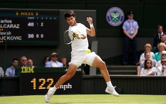 Carlos Alcaraz in action against Novak Djokovic during the Gentlemen's Singles final on day fourteen of the 2023 Wimbledon Championships at the All England Lawn Tennis and Croquet Club in Wimbledon. Picture date: Sunday July 16, 2023.