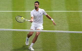 Novak Djokovic in action against Carlos Alcaraz during the Gentlemen's Singles final on day fourteen of the 2023 Wimbledon Championships at the All England Lawn Tennis and Croquet Club in Wimbledon. Picture date: Sunday July 16, 2023.