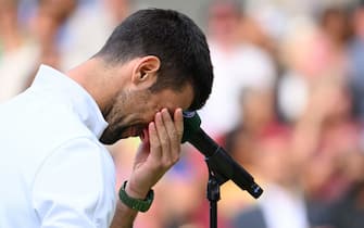 LONDON, ENGLAND - JULY 16: Novak Djokovic holds his head in his hands as Carlos Alcaraz wins the Wimbledon 2023 men's final on Centre Court during day fourteen of the Wimbledon Tennis Championships at the All England Lawn Tennis and Croquet Club on July 16, 2023 in London, England. (Photo by Karwai Tang/WireImage)