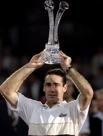 29 Nov 1998:  Alex Corretja of Spain lifts the trophy after victory over Carlos Moya in the final of the ATP Tour World Championships at the EXPO 2000 Tennis Dome in Hannover, Germany. Corretja won in five sets. \ Mandatory Credit: Gary M Prior/Allsport