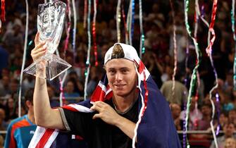 18 Nov 2001:   Lleyton Hewitt of Australia celebrates his victory over Sabastien Grosjean of France with the championship trophy during the Final of the Tennis Masters Cup held at the Sydney Superdome, Sydney, Australia.  DIGITAL IMAGE Mandatory Credit:Nick Laham/ALLSPORT