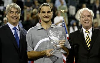 HOUSTON - NOVEMBER 16:  ATP CEO Mark Miles and Graf Vitzthum of Daimler Chrysler pose with Roger Federer of Switzerland after his victory over Andre Agassi during the finals of the Tennis Masters Cup November 16, 2003 at the Westside Tennis Club in Houston, Texas.  (Photo by Clive Brunskill/Getty Images)
