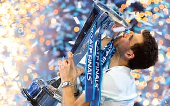 Grigor Dimitrov celebrates winning the Men's Singles Final by holding aloft the trophy (Photo by Adam Davy/PA Images via Getty Images)