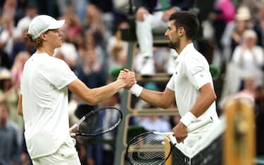 LONDON, ENGLAND - JULY 14: Novak Djokovic of Serbia shakes hands with his opponent following his victory in the Men's Singles Semi Finals against Jannik Sinner of Italy on day twelve of The Championships Wimbledon 2023 at All England Lawn Tennis and Croquet Club on July 14, 2023 in London, England. (Photo by Julian Finney/Getty Images)