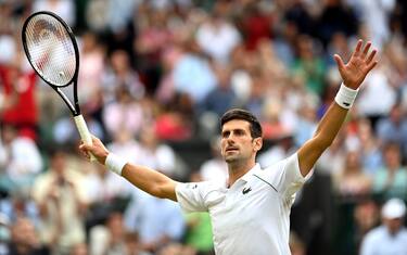 epa09334517 Novak Djokovic of Serbia celebrates after winning his men's semi final match against Denis Shapovalov of Canada at the Wimbledon Championships in Wimbledon, Britain, 09 July 2021. EPA/NEIL HALL EDITORIAL USE ONLY