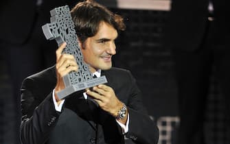 BASEL, SWITZERLAND - NOVEMBER 01:  Roger Federer of Switzerland poses with the Number 1 History-Award during day two of the Swiss Indoors at St Jakobshalle on November 1, 2011 in Basel, Switzerland.  (Photo by Harold Cunningham/Getty Images)