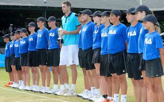 NEWPORT, RI - JULY 23: (Photo by Andrew Snook/Icon Sportswire via Getty Images) John Isner (USA) with the "ballboys" after his final match in the Dell Technologies Hall of Fame Tennis Championships on July 22, 2017 at the International Tennis Hall of Fame & Museum in Newport, Rhode Island.  Isner won 6-3 7-6 winning the Hall of Fame Tennis Championships for the second time. (Photo by Andrew Snook/Icon Sportswire via Getty Images)
