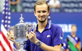 NEW YORK, NEW YORK - SEPTEMBER 12: Daniil Medvedev of Russia celebrates with the championship trophy after defeating Novak Djokovic of Serbia to win the Men's Singles final match on Day Fourteen of the 2021 US Open at the USTA Billie Jean King National Tennis Center on September 12, 2021 in the Flushing neighborhood of the Queens borough of New York City.  (Photo by Matthew Stockman/Getty Images)