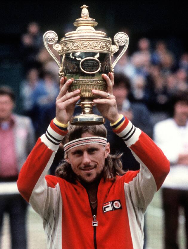 LONDON, UNITED KINGDOM - JULY 11:  Swedish tennis player Bj?rn Borg raises his fourth Wimbledon Cup, won in London 07 July 1979. Born in S?dertSlje, Borg first major title was the Italian Open (1974) and he went on to become Wimbledon singles champion five times in succession (1976-80). He also won the French singles title six times, and was the World Championship Tennis singles champion in 1976, and Masters champion in 1979 and 1980. He retired in 1981, but made three comebacks in 1982,1984, and 1992.  (Photo credit should read JACOB FORSELL/AFP via Getty Images)