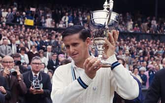 1965:  Australian tennis player Roy Emerson with the men's singles trophy after beating fellow Australian Fred Stolle in the final at the Wimbledon Lawn Tennis Championships.  (Photo by Central Press/Getty Images)