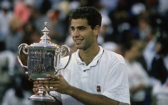 NEW YORK - CIRCA 1995: Pete Sampras of the United States holds the trophy after defeating Andre Agassi in the championship match 6-4, 6-3, 4-6, 7-5 during the Men's 1995 US Open Tennis Championships circa 1995 at the National Tennis Center in the Queens borough of New York City. (Photo by Focus on Sport/Getty Images)