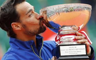 epa07520137 Fabio Fognini of Italy poses with his trophy after winning against Dusan Lajovic of Serbia in their final match of the Monte-Carlo Rolex Masters tournament in Roquebrune Cap Martin, France, 21 April 2019.  EPA/SEBASTIEN NOGIER