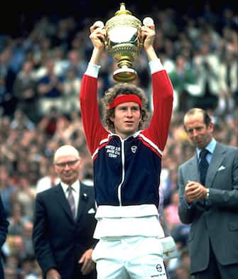 JUL 1981:  JOHN MCENROE OF THE UNITED STATES LIFTS THE TROPHY OVER HIS HEAD AFTER WINNING THE 1981 WIMBLEDON TENNIS CHAMPIONSHIPS.