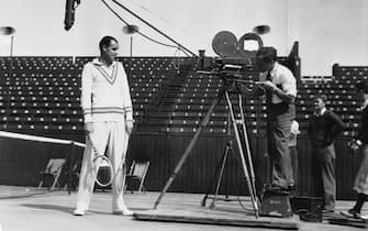 circa 1925:  William T Tilden, (1893 - 1953) making an instructional tennis film. Known as Big Bill, he was first American male to win the men's singles title at Wimbledon.  (Photo via John Kobal Foundation/Getty Images)