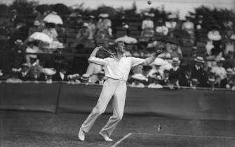 July 1908:  Anthony Wilding of New Zealand in action during the tennis championships at Wimbledon.  (Photo by Topical Press Agency/Getty Images)