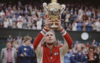 Bjorn Borg of the Sweden holds the trophy aloft after defeating Jimmy Connors of the United States during the Men's Singles Final match at the Wimbledon Lawn Tennis Championship on 8 July 1978 at the All England Lawn Tennis and Croquet Club in Wimbledon in London, England. (Photo by Fox Photos/Getty Images)