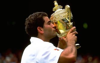 5 Jul 1998:    Pete Sampras kisses the trophyduring the 1998 Wimbledon Championships played at Wimbledon, London, England. \ Mandatory Credit: Gary M Prior/Allsport