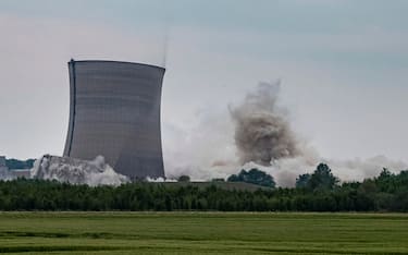 epa08420983 A handout drone photo made available by Energie Baden-Wurttemberg (EnBW) shows the controlled demolition of a cooling tower at a decommissioned nuclear power plant in Philippsburg, Germany, 14 May 2020. The nuclear power plant in Philippsburg was completely shut down by 31 December 2019 and is in the process of being demolished, according to the operator, Energie Baden-Wurttemberg (EnBW).  EPA/ULI DECK / HANDOUT EDITORIAL USE ONLY/NO SALES HANDOUT EDITORIAL USE ONLY/NO SALES