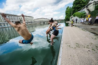 A moment of the event of Legambiente  ''Big Jump a dip in the river Po'', to raise public awareness on the quality of water, Turin, Italy, 12 July 2020.   ANSA/TINO ROMANO