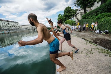 A moment of the event of Legambiente ''Big Jump a dip in the river Po'', to raise public awareness on the quality of water, Turin, Italy, 12 July 2020. ANSA/TINO ROMANO
