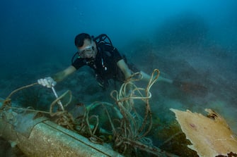 SAINT-MARTIN, FRENCH ANTILLES - NOVEMBER 2017: Franck Roncuzzi, a member of the French Agency for Biodiversity and head of environmental police who works at the Marine Natural Park of St. Martin is diving to take a stock few weeks after hurricane Irma on November 14, 2017, Saint-Martin, French Antilles. During his dive, he noticed a lot of debris from boats or other objects from the island. (Photo by Alexis Rosenfeld/Getty Images)