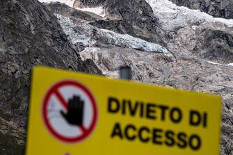 This picture taken on August 6, 2020, shows a sign reading "Access denied" in front of the Planpincieux glacier, in the village of La Palud, in Courmayeur, Val Ferret, northwestern Italy. - The glacier have started to move 1 meter per day due to high temperatures and the local government has decided to evacuate 60 people from the valley for danger of collapse. (Photo by MARCO BERTORELLO / AFP) (Photo by MARCO BERTORELLO/AFP via Getty Images)