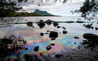 A picture taken on August 15, 2020 shows iridescence on the water at the beach in Petit Bel Air, due to the oil leaked from vessel MV Wakashio, belonging to a Japanese company but Panamanian-flagged, that ran aground near Blue Bay Marine Park off the coast of south-east Mauritius. - A fresh streak of oil spilled on August 14, 2020, from a ship stranded on a reef in pristine waters off Mauritius, threatening further ecological devastation as demands mount for answers as to why the vessel had come so close to shore. (Photo by Fabien Dubessay / AFP) (Photo by FABIEN DUBESSAY/AFP via Getty Images)