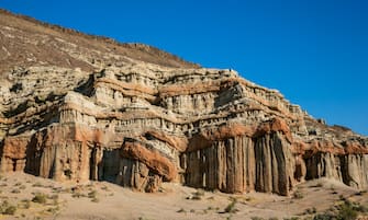 MOJAVE, CA - JUNE 30:  Red Rock Canyon State Park features scenic desert cliffs, buttes and spectacular rock formations as viewed on June 30, 2017, near Mojave, California.  Located between Los Angeles and the Owens Valley, this unique desert setting provides dramatic vistas and has been a backdrop for hundreds of Hollywood motion pictures, television shows, advertisements, and music videos. (Photo by George Rose/Getty Images)