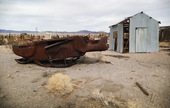 LUDLOW, CALIFORNIA - SEPTEMBER 22: The remnants of an old car remain in an abandoned section of town in the Mojave desert on September 22, 2019 in Ludlow, California. California's Fourth Climate Change Assessment found that temperatures of the inland deserts of Southern California, including the Mojave desert, are expected to continue climbing. According to the report, average daily highsÂ could increase as much as 14 degrees this centuryÂ if greenhouse gas emissions keep rising.  (Photo by Mario Tama/Getty Images)