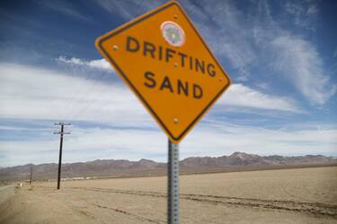 AMBOY, CALIFORNIA - SEPTEMBER 22: A 'Drifting Sand' sign is posted in the Mojave desert on September 22, 2019 in Amboy, California. California's Fourth Climate Change Assessment found that temperatures of the inland deserts of Southern California, including the Mojave desert, are expected to continue climbing. According to the report, average daily highs could increase as much as 14 degrees this century if greenhouse gas emissions keep rising. (Photo by Mario Tama/Getty Images)