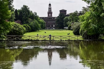 A general view shows the Sforza Castle and the Parco Sempione park on May 4, 2020 in Milan, as Italy starts to ease its lockdown, during the country's lockdown aimed at curbing the spread of the COVID-19 infection, caused by the novel coronavirus. - Stir-crazy Italians will be free to stroll and visit relatives for the first time in nine weeks on May 4, 2020 as Europe's hardest-hit country eases back the world's longest nationwide coronavirus lockdown. (Photo by Miguel MEDINA / AFP) (Photo by MIGUEL MEDINA/AFP via Getty Images)