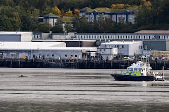 GARELOCHEAD, SCOTLAND - OCTOBER 01: One of the three Northern Bottlenose whales is seen in the Gare Loch as boats try to herd them into the open sea ahead of a military exercise starting in the region on October 1, 2020 in Garelochhead, Argyll and Bute.Three northern bottlenose whales have been stuck in Gare Loch near Faslane Naval Base, apparently unable to find their way back to the North Atlantic. (Photo by Jeff J Mitchell/Getty Images)