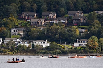 GARELOCHEAD, SCOTLAND - OCTOBER 01: Boats are seen attempting to herd Northern Bottlenose whales from the Gare Loch into the open sea ahead of a military exercise starting in the region on October 1, 2020 in Garelochhead, Argyll and Bute.Three northern bottlenose whales have been stuck in Gare Loch near Faslane Naval Base, apparently unable to find their way back to the North Atlantic. (Photo by Jeff J Mitchell/Getty Images)