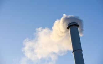 Smoke stall Chimney was pumping out black smoke pollution.