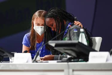 MICO, MILAN, ITALY - 2021/09/28: Vanessa Nakate (R) cries after her speech as Greta Thunberg comforts her during opening plenary session of the Youth4Climate pre-COP26 event. The 2021 United Nations Climate Change Conference, also known as COP26, is scheduled to be held in the city of Glasgow, Scotland between 31 October and 12 November 2021. (Photo by NicolÃ² Campo/LightRocket via Getty Images)