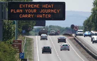 A matrix sign over the A19 road towards Teesside displays an extreme weather advisory as the UK braces for the upcoming heatwave. Picture date: Saturday July 16, 2022. (Photo by Owen Humphreys/PA Images via Getty Images)