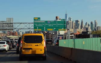 NEW YORK, NY - APRIL 27: Morning rush hour traffic proceeds along Interstate 278 in Brooklyn in front of lower Manhattan and  One World Trade Center on April 27, 2022, in New York City. (Photo by Gary Hershorn/Getty Images)