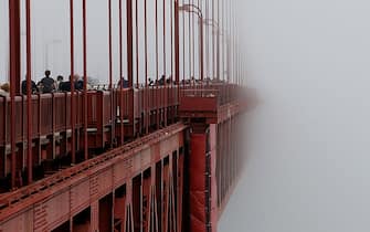 SAN FRANCISCO, CA - JUNE 27: The span of the Golden Gate Bridge disappears into the fog on June 27, 2014 in San Francisco, California. The Golden Gate Bridge district's board of directors voted unanimously to approve a $76 million funding package to build a net suicide barrier on the iconic span. Over 1,500 people committed suicide by jumping from the iconic bridge since it opened in 1937. 46 people jumped to their death in 2013. (Photo by Justin Sullivan/Getty Images)