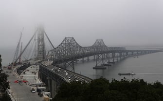 Fog hovers over the new and present eastern side of the bay bridge in San Francisco, Calif., on Friday, September 28, 2012. (Photo By Liz Hafalia/The San Francisco Chronicle via Getty Images)