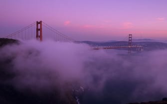 UNITED STATES - 1995/01/01: USA, California, San Francisco, Golden Gate Bridge At Dusk, With Fog Rolling In. (Photo by Wolfgang Kaehler/LightRocket via Getty Images)
