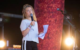 epa10033933 Swedish Climate activist Greta Thunberg makes a speech on the Pyramid Stage at Glastonbury Festival, Pilton, Britain, 25 June 2022. The Glastonbury Festival of Contemporary Performing Arts is taking place for the first time in three years after a hiatus due to COVID-19 pandemic restrictions. The festival runs from 22 to 26 June 2022.  EPA/JON ROWLEY