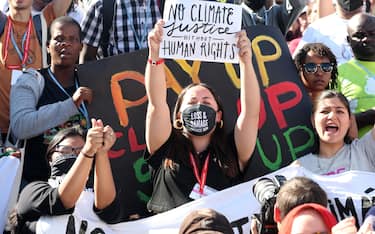 epa10301402 Climate activists protest demanding climate justice during the COP27 UN Climate Summit in Sharm El-Sheikh, Egypt, 12 November 2022. The 2022 United Nations Climate Change Conference (COP27), runs from 06-18 November, and is expected to host one of the largest number of participants in the annual global climate conference as over 40,000 estimated attendees, including heads of states and governments, civil society, media and other relevant stakeholders will attend. The events will include a Climate Implementation Summit, thematic days, flagship initiatives, and Green Zone activities engaging with climate and other global challenges.  EPA/KHALED ELFIQI