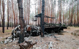 KHARKIV REGION, UKRAINE - OCTOBER 26, 2022 - A burnt-out Russian charger for a BM-21 Grad multiple rocket launcher is pictured in a forest near Izium, Kharkiv Region, northeastern Ukraine.