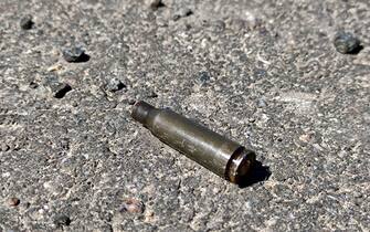807876_019 A cartridge lies on the ground in the Chernobyl Exclusion Zone after the withdrawal of Russian troops, Kyiv Region, northern Ukraine, April 28, 2022. Russian forces have vacated the area surrounding Chernobyl, but Ukrainian officials are now sounding the alarm that troops were likely exposed to high amounts of radiation after they intentionally disturbed radioactive dust. Workers at the Chernobyl Nuclear Power Plant (NPP), the site of the 1986 nuclear disaster, have warned for weeks that Russian troops were kicking up clouds of radioactive dust after driving armored vehicles through an area known as the “red forest.” Photo by Hennadii Minchenko/Ukrinform/ABACAPRESS.COM