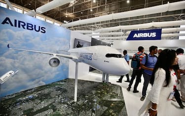 epa10468364 Visitors get information at the 'Airbus' exhibition stall during the day-three of the 14th Edition of Aero India 2023, at the Yelahanka Air Force Base, in Bangalore, India, 15 February 2023. More than 800 international defense and aerospace Companies have participated in the Asia s largest Aero India event which showcases warfare equipment including new fighter planes, next-generation submarines, warships, helicopters, missiles, howitzers, air defense systems, assault weapons and all kind of military gear from 13 to 17 February 2023.  EPA/JAGADEESH NV